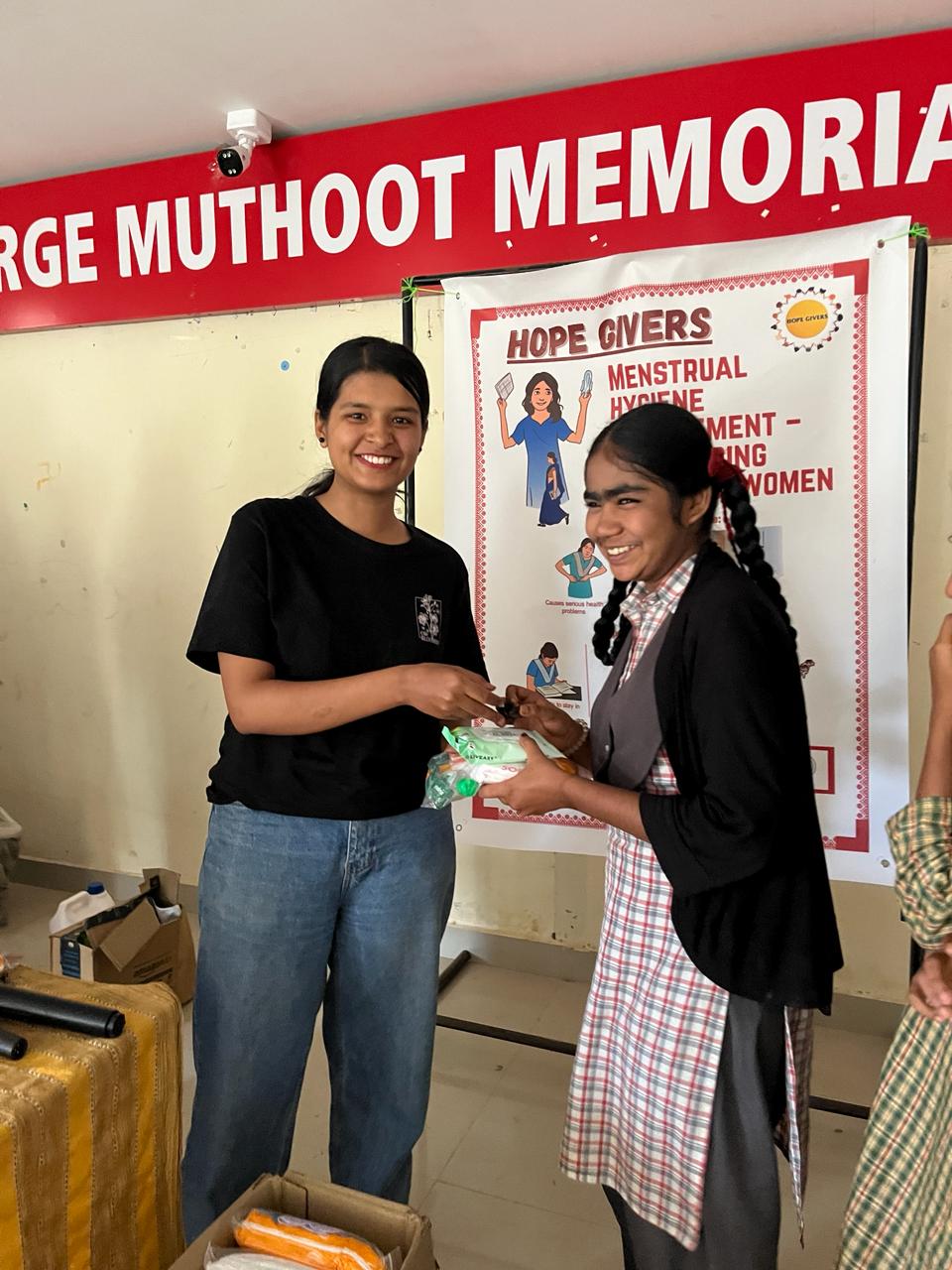 Distribution of menstrual hygiene kits at a health awareness event.